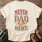 Never Underestimate A Dad On A Bike Tee — ivory
